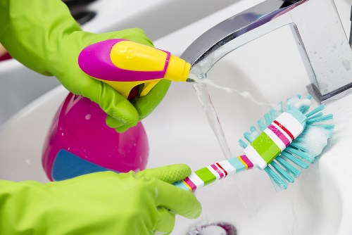 Technician handling textile and fabric waste for specialist recycling in London