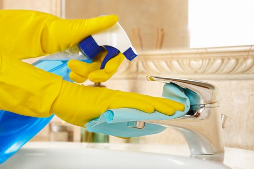 Commercial cleaner maintaining shared office kitchen surfaces