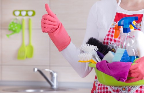 Office cleaners working in a busy London workplace reception area