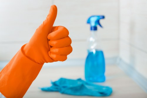 Staff member handling carpet cleaning chemicals with care