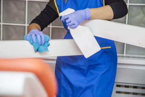 Local oven cleaner working in a busy London kitchen